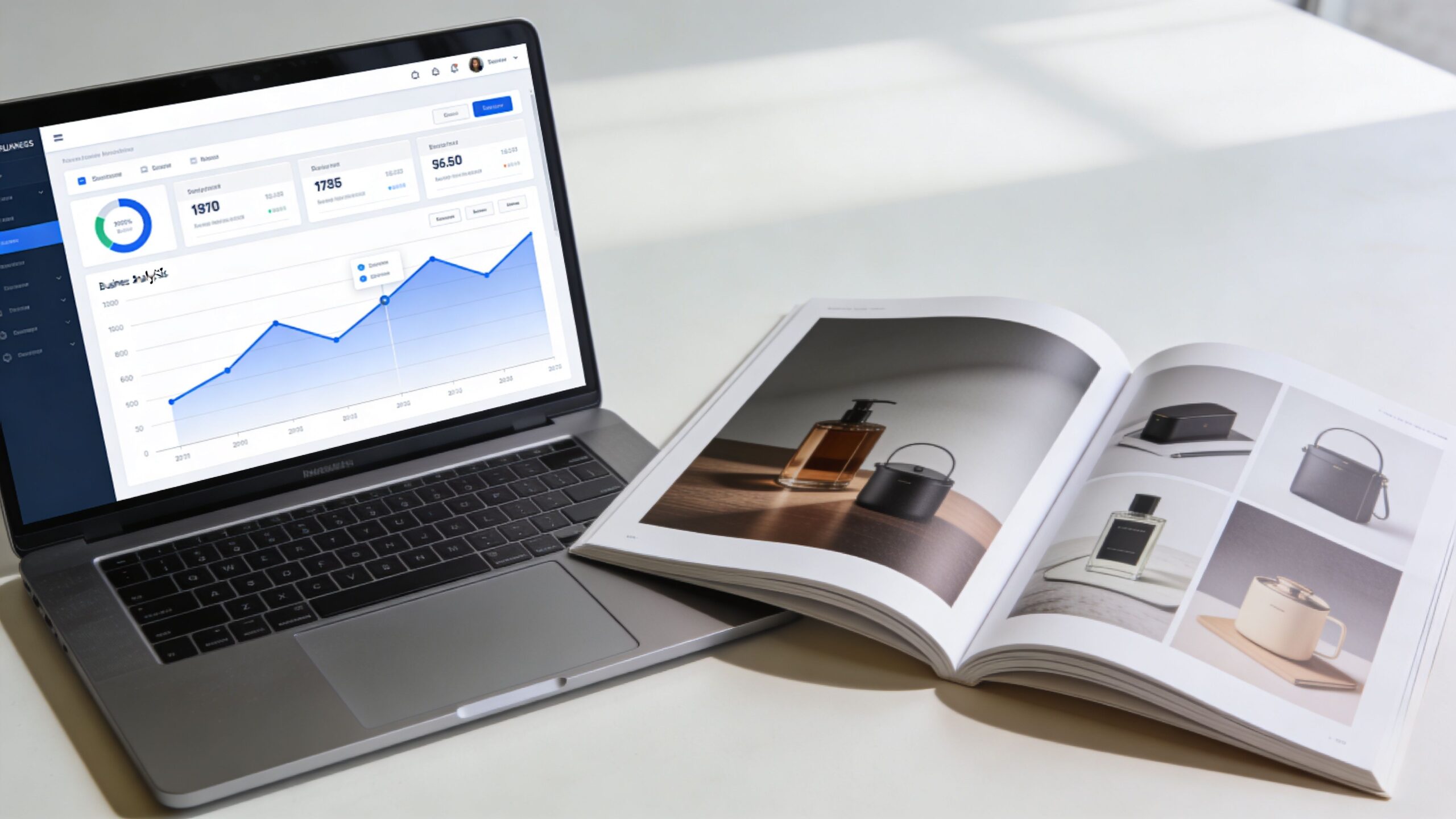A laptop displaying a business analytics dashboard placed next to an open product catalog magazine.