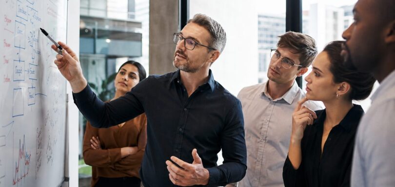 Australian business team collaborating on AI search strategy at a whiteboard