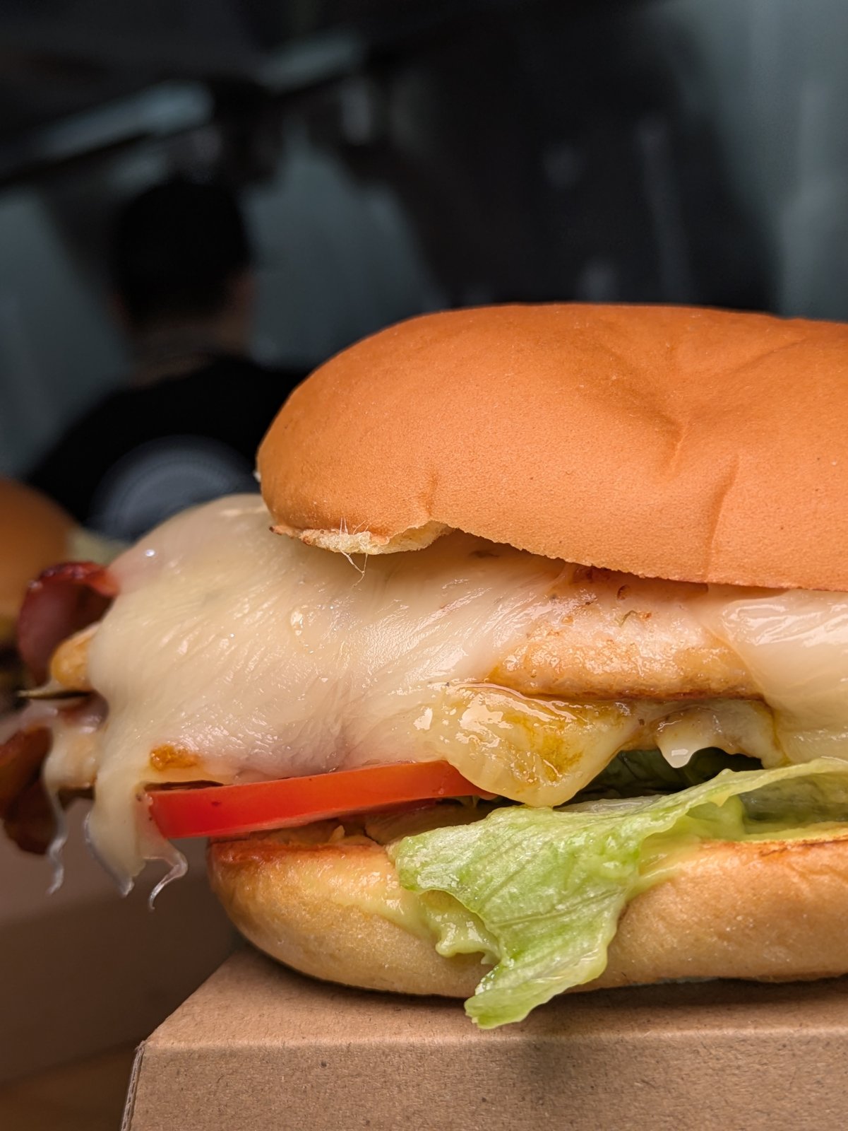 Eat at ROBs chicken burger with melted cheese and salad