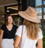 Gold Coast small business owner welcoming a customer at a local shopfront