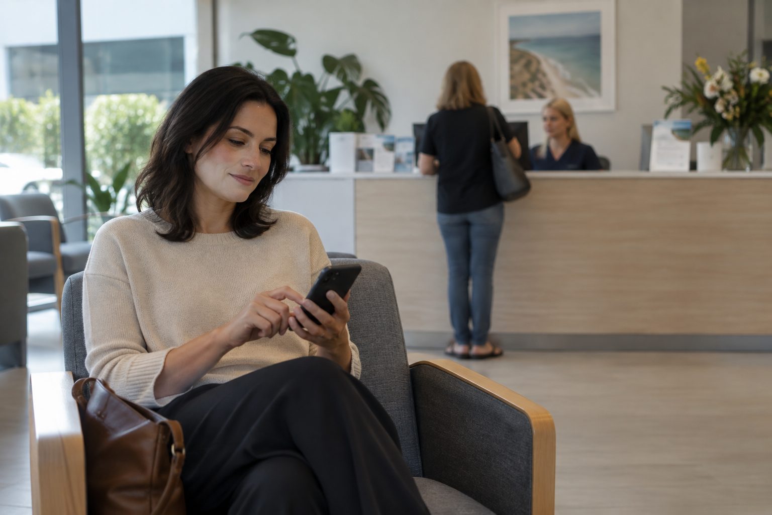 Patient checking in for a GP appointment on a smartphone in a clinic waiting room