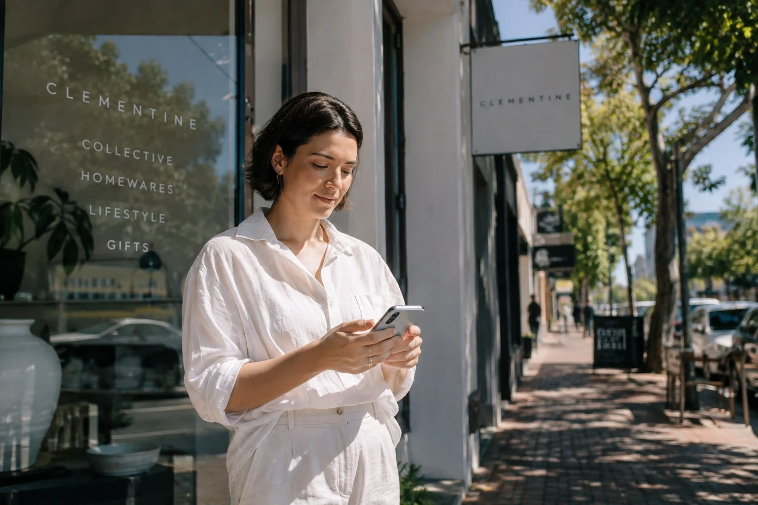 Physiotherapy clinic owner in Adelaide reviewing website performance on a tablet at reception
